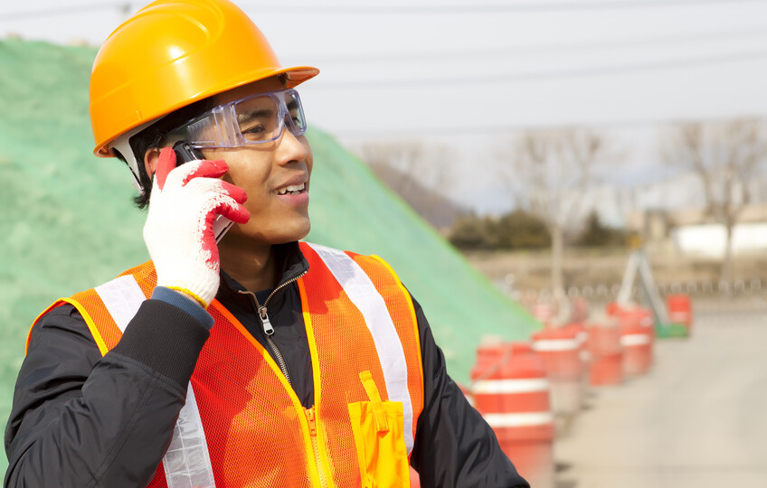 Construction worker talking on the phone