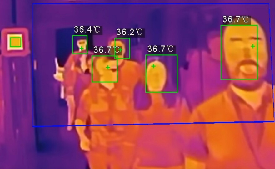 Thermal camera system can scan body temperatures on people as quickly as they can walk through to help identify individuals potentially infected by COVID-19 or other viruses