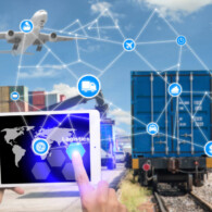 Hand holding tablet is pressing button Logistics connection technology interface global partner connection for logistic import export background. Business logistics concept internet of things