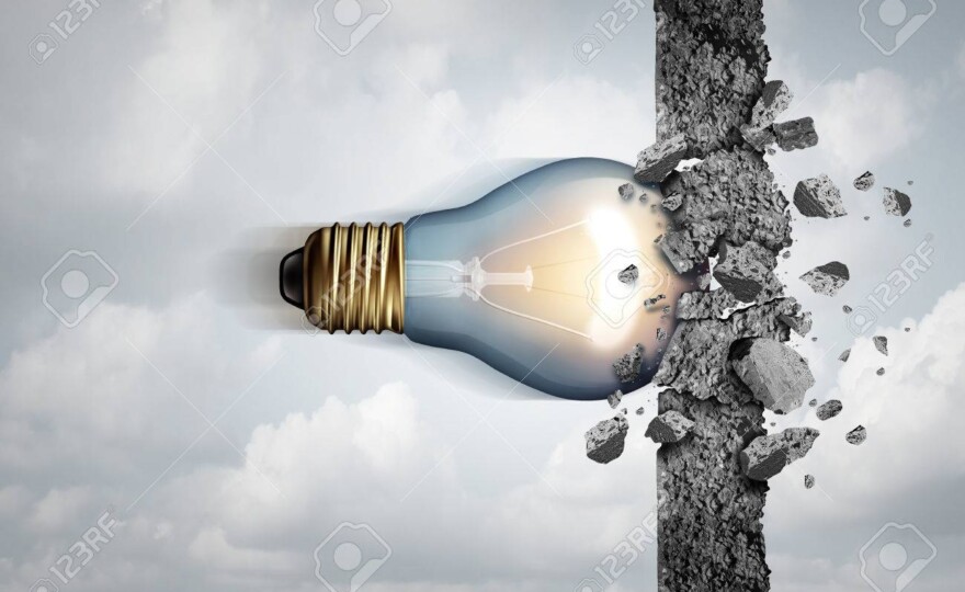 Power of ideas and unlimited creative strength as a light bulb breaking through a cement wall as a creativity force metaphor or business concept for thinking innovation with 3D illustration elements.